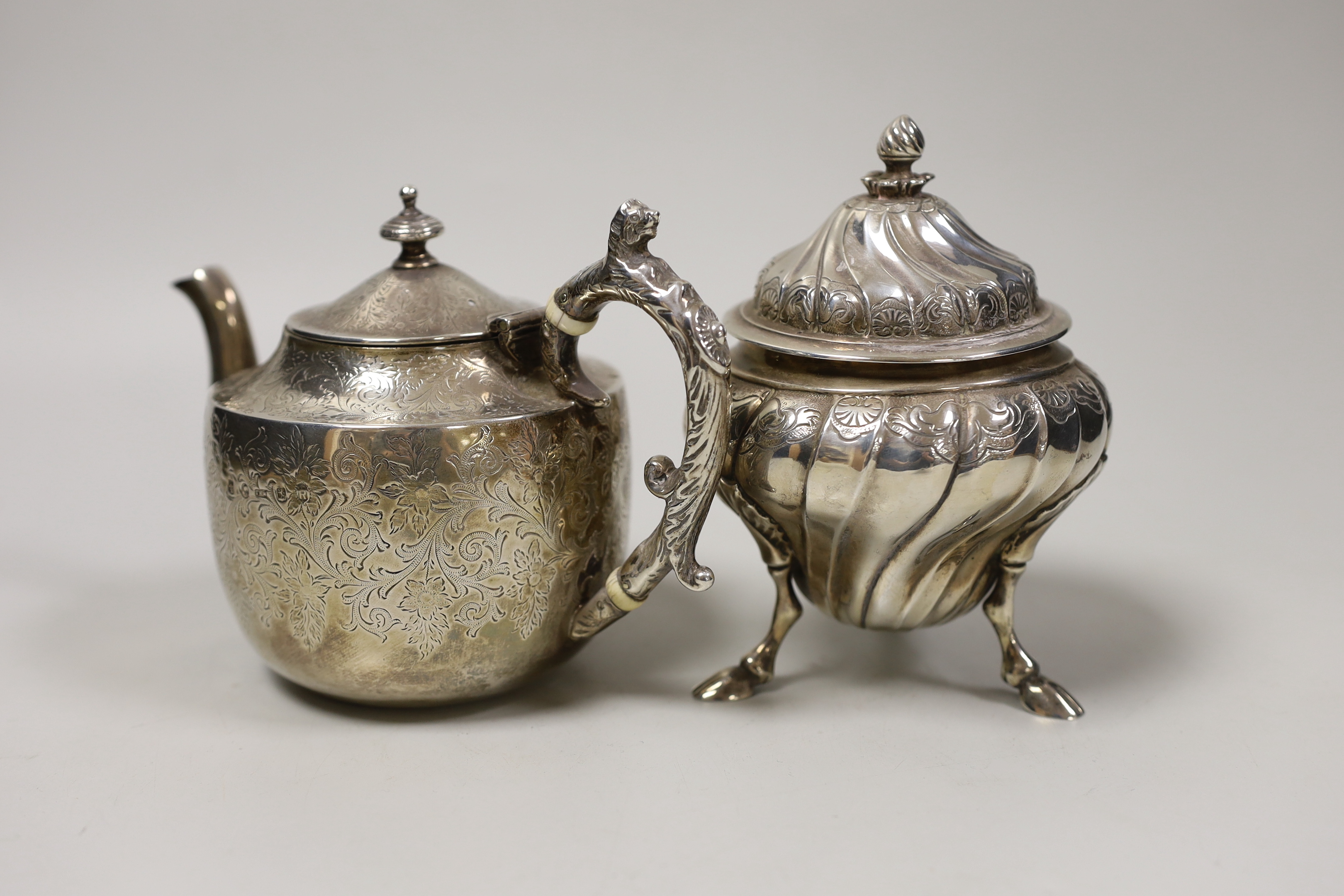 A small Victorian Scottish silver bachelor's teapot with ivory insulators, Glasgow, 1888 together with a small 1930's lidded silver tea caddy, gross weight 19oz.